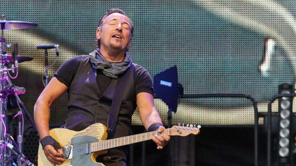 Springsteen performs on stage with guitar