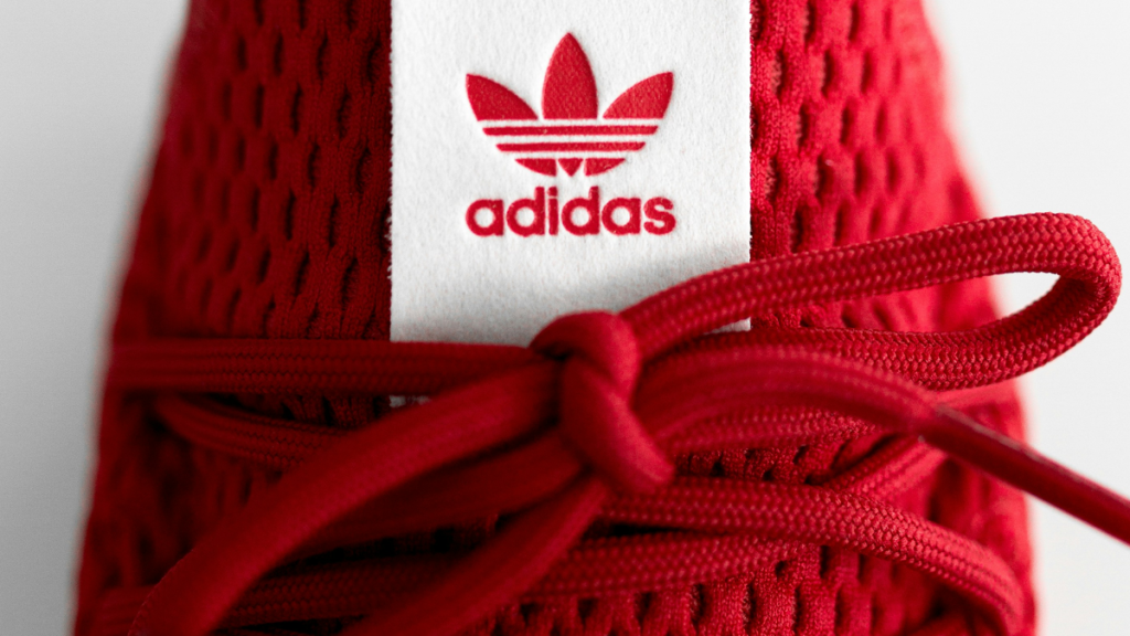 Red and white Adidas sneakers