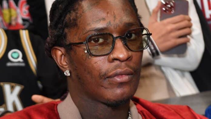 Young Thug wearing glasses and jewelry