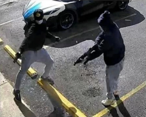 Two masked shooters facing each other