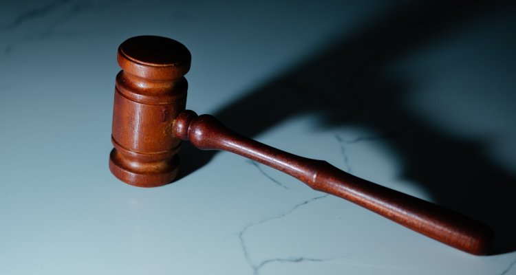 Wooden gavel on marble surface