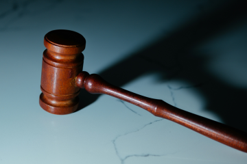 Wooden gavel on marble surface