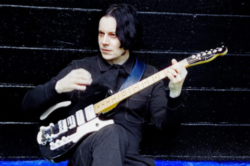 Jack White with guitar on stage