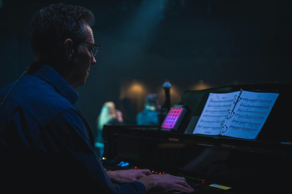 Man performs on grand piano