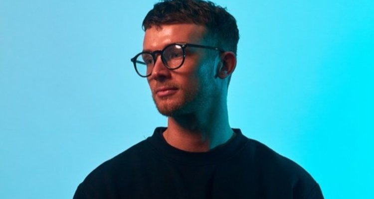 Man wearing glasses and black shirt