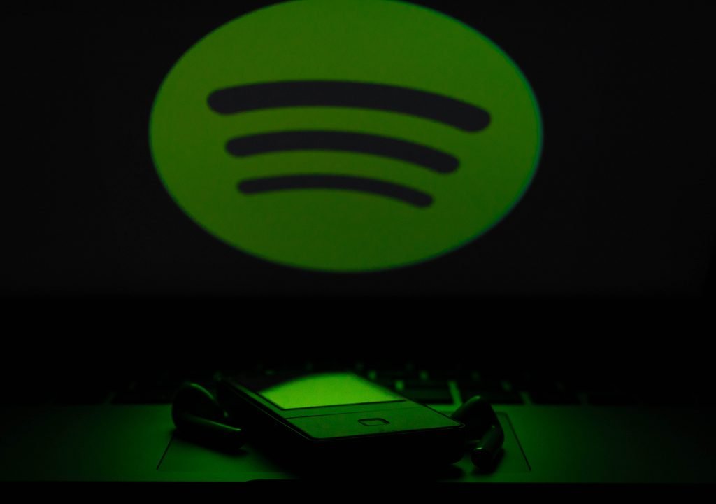 Spotify logo with phone and headphones