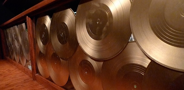 Gold records displayed on wall