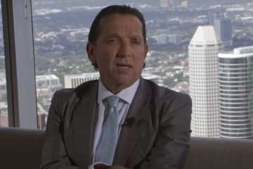 Attorney in suit, cityscape backdrop