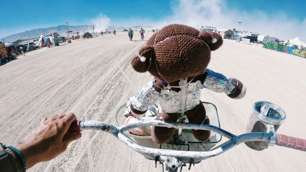 Teddy bear biking at Burning Man