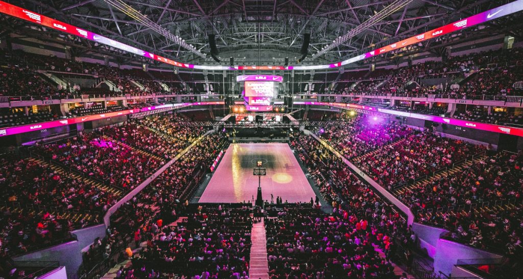 Packed NBA stadium with bright lighting