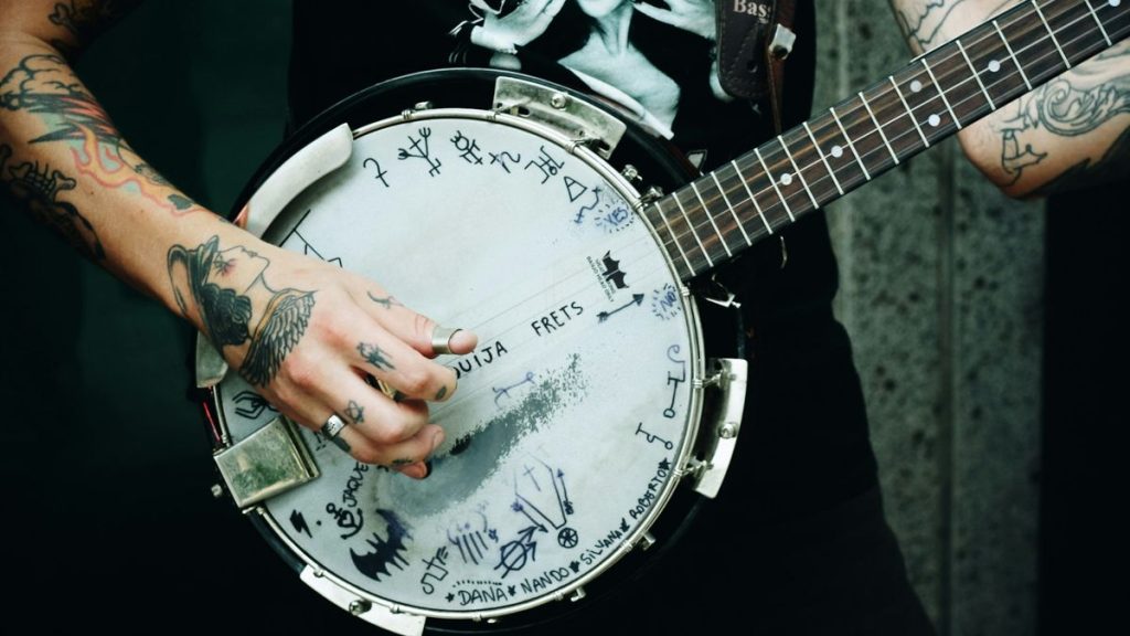 Musician strumming banjo at Ronnie Scott's