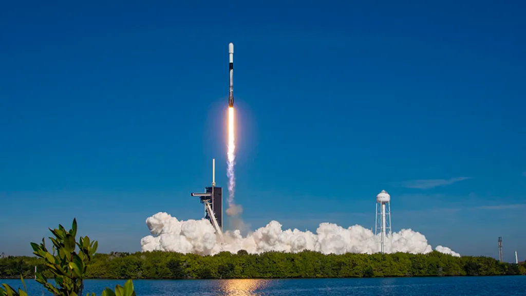 SpaceX rocket launching into starlit sky