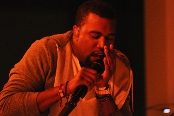 Kanye West speaking with microphone