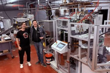 Workers at vinyl record pressing plant