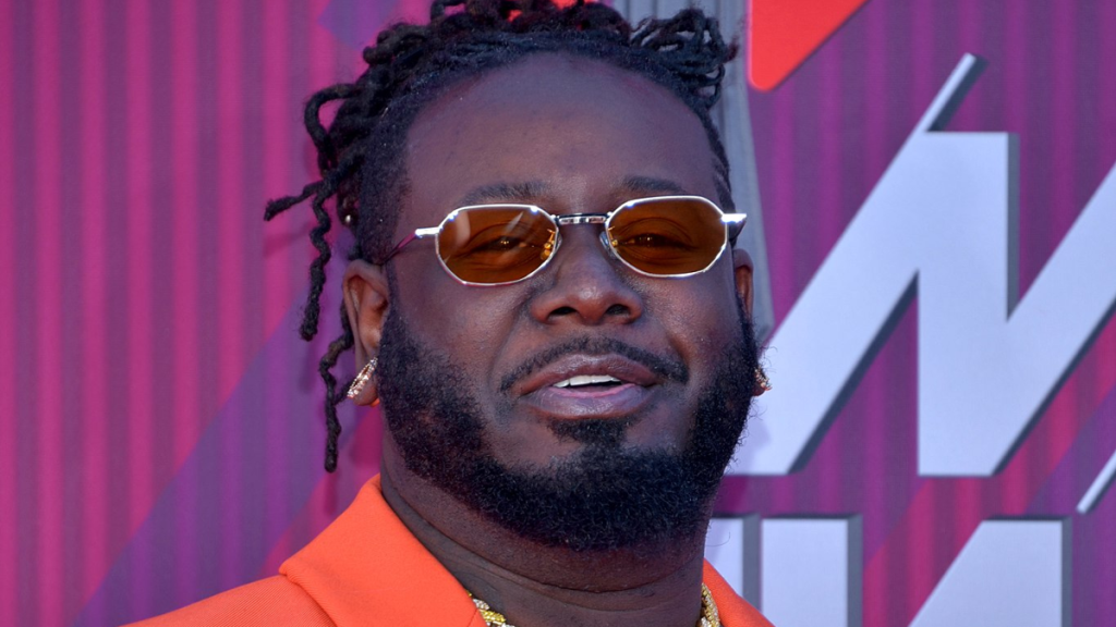 T-Pain in front of publishing backdrop