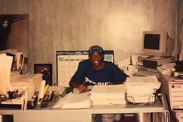 Man at desk with clutter